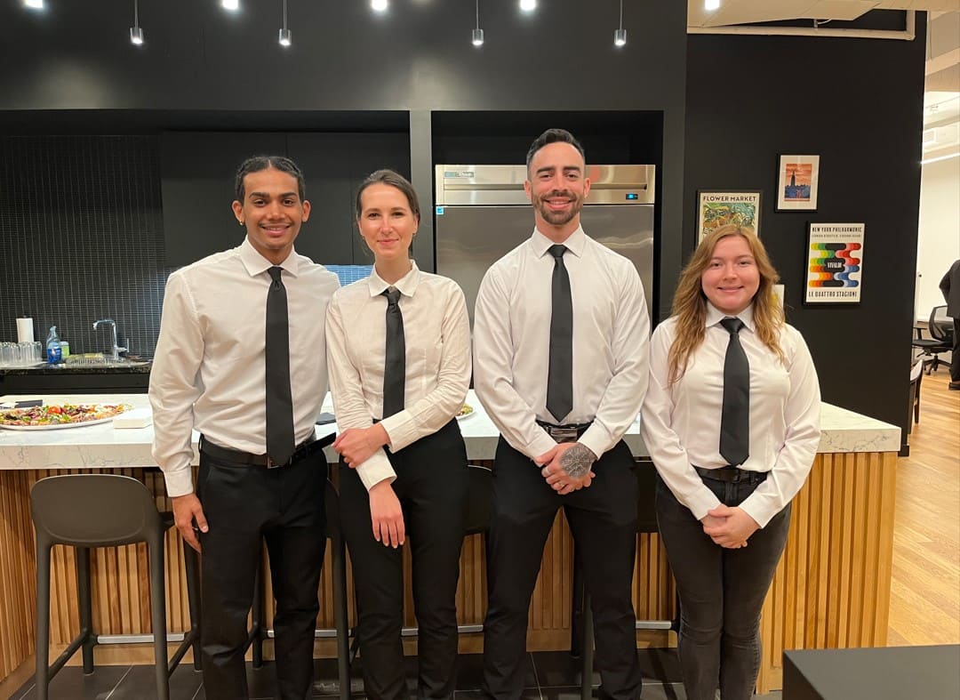Professional wait staff serving guests at an elegant wedding or private event in NYC