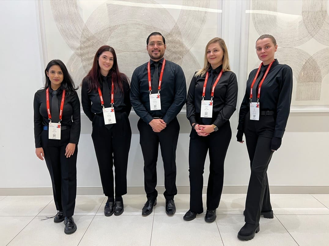Event check-in staff greeting guests at entry