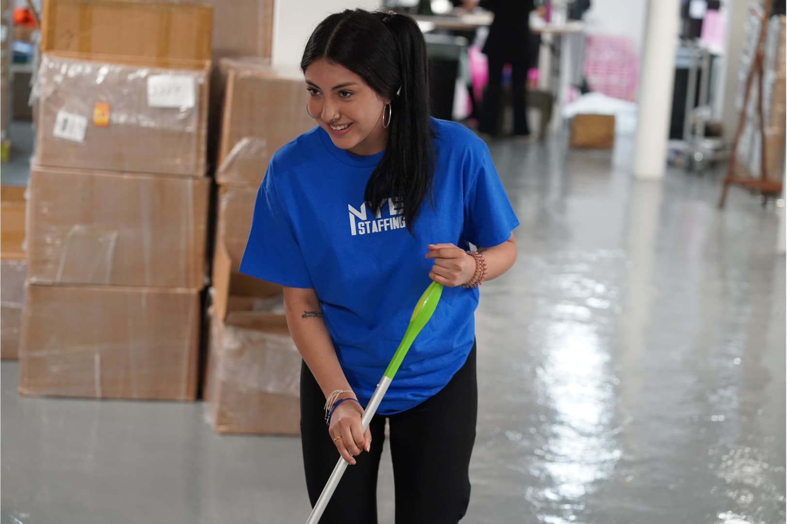 NYE Staffing cleaning woman working in Orlando Venue mopping the floor