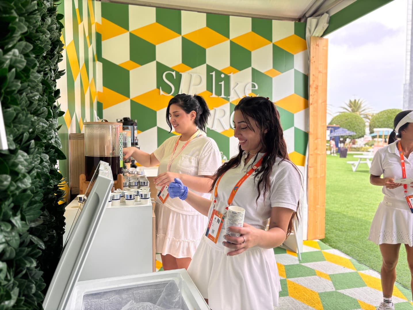 Event staff promoting sponsor activation in Miami