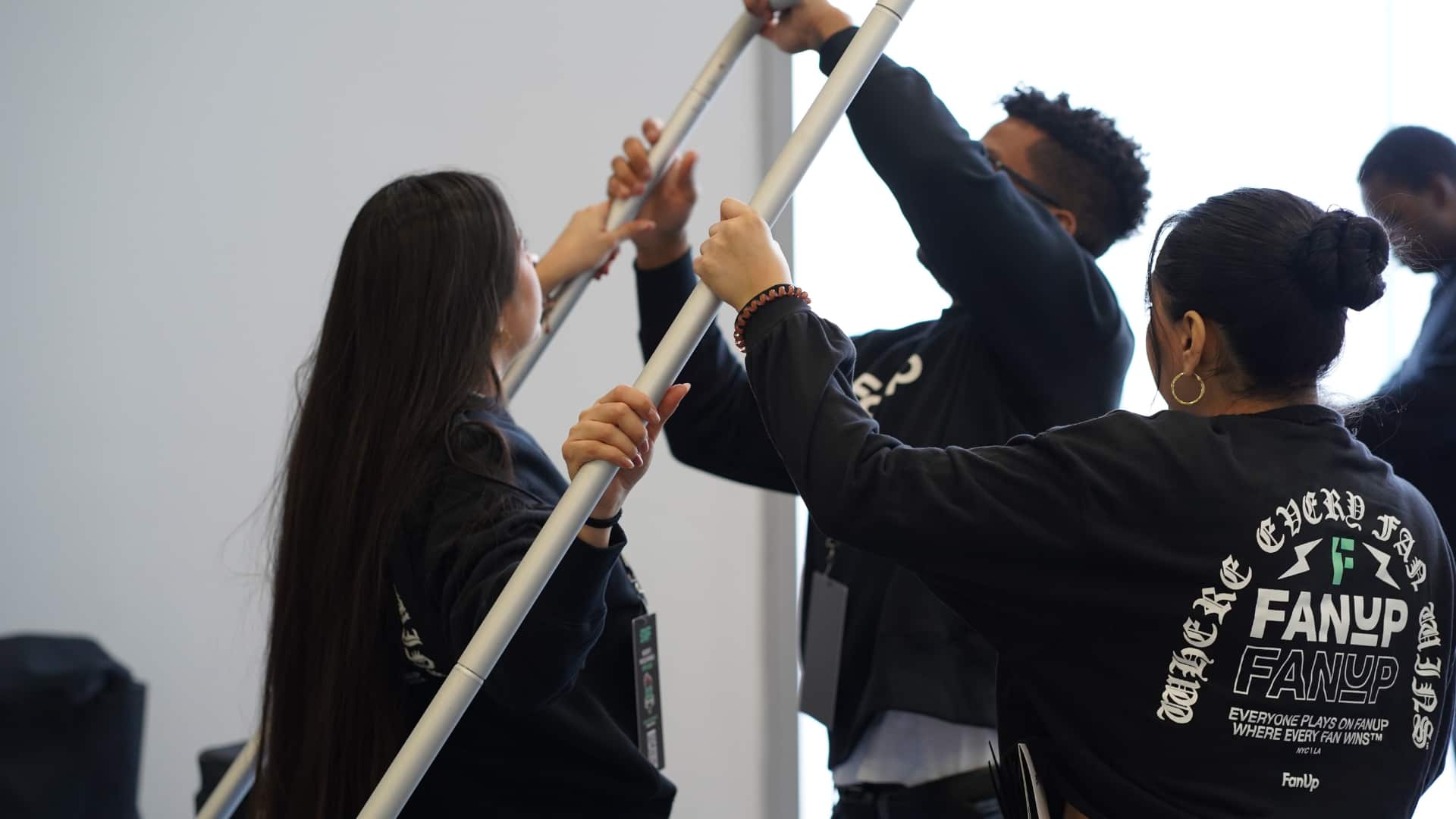 Event staff team organizing and setting up a trade show booth in New York City