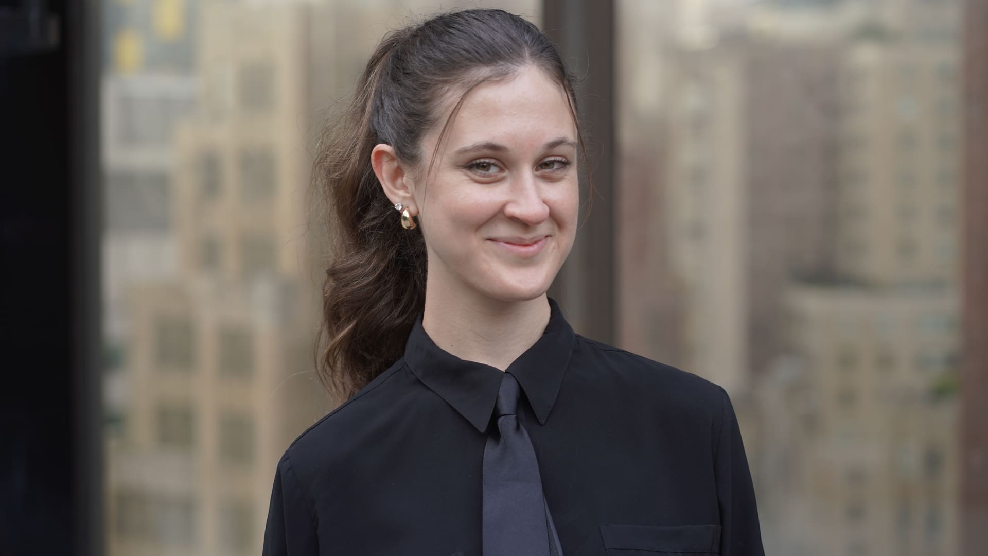 Trade show model welcoming visitors at a brand booth in Hartford, Connecticut