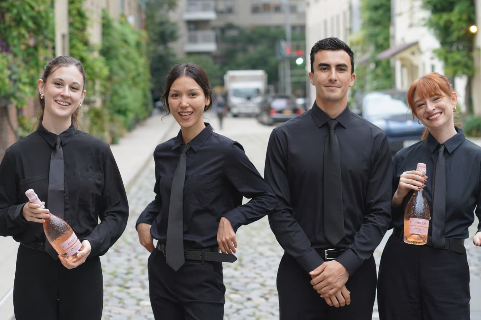 NYE Staffing bartenders serving rose bottles at an event in New York City