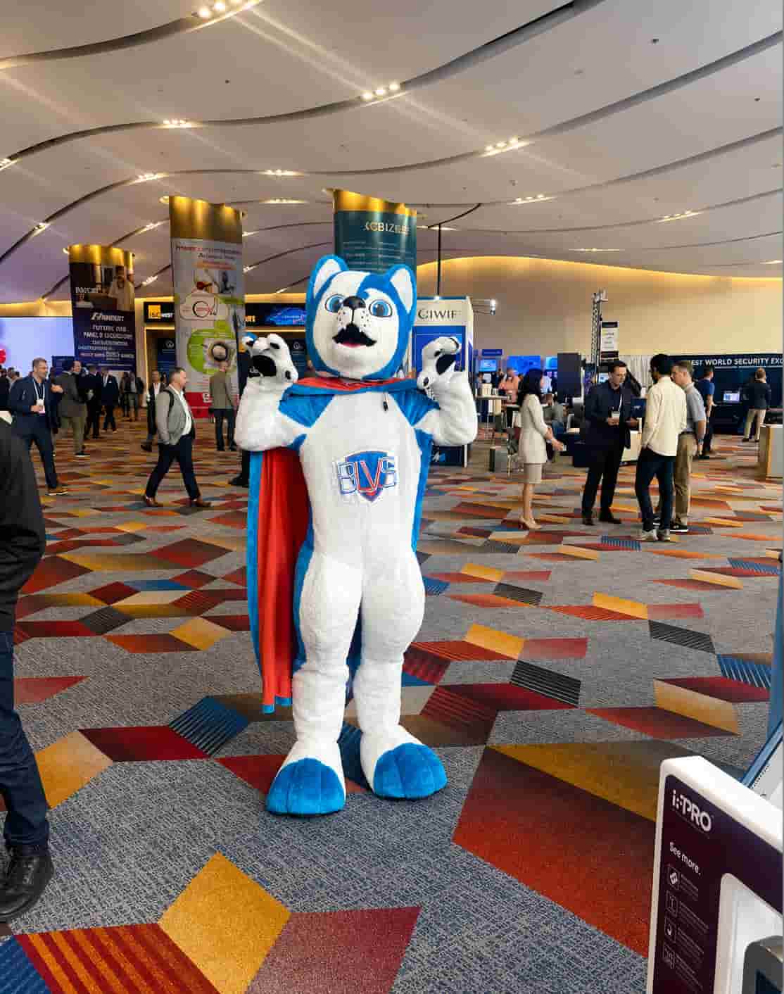NYE Staffing mascot performer interacting with attendees and creating crowd engagement during a large convention activation at a Las Vegas trade show venue