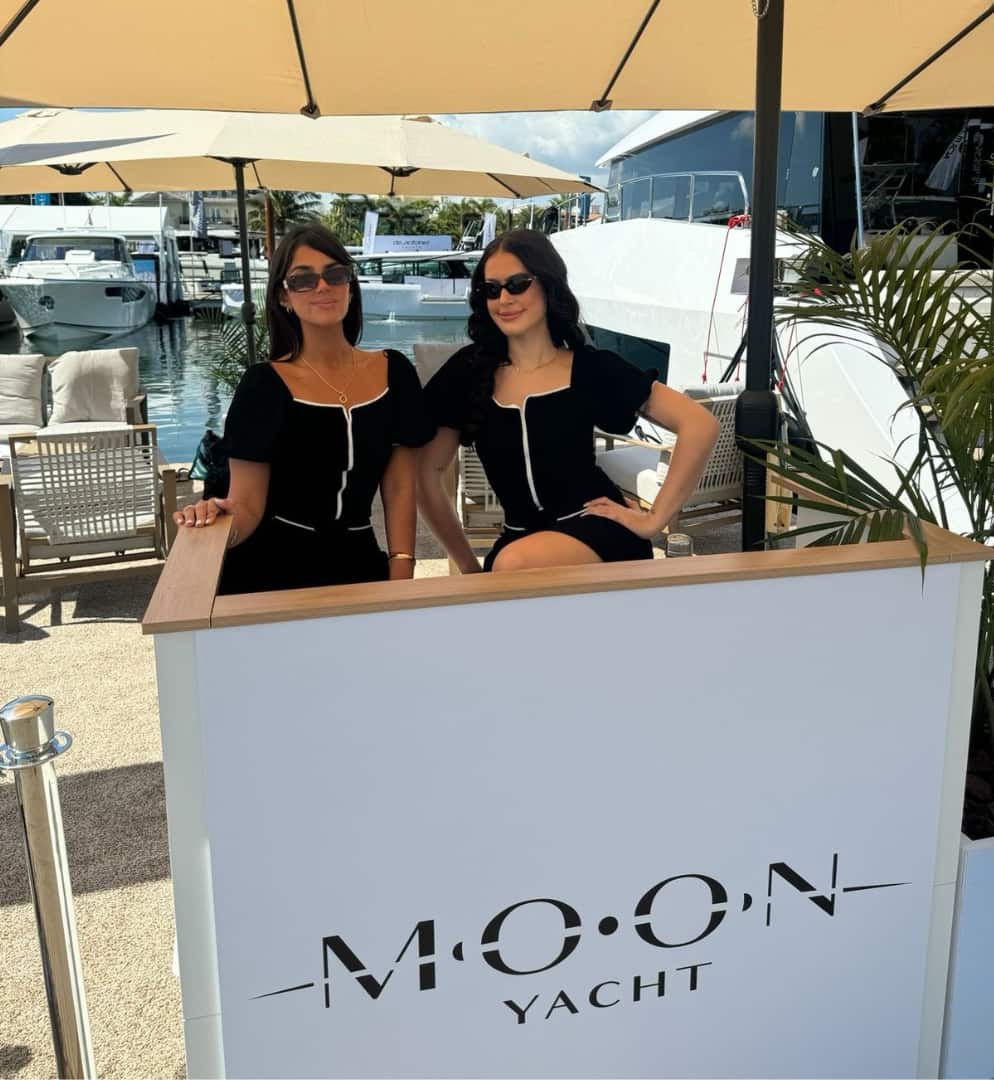 Luxury yacht hospitality hostess welcoming guests during Miami International Boat Show event staffing activation in Miami Florida