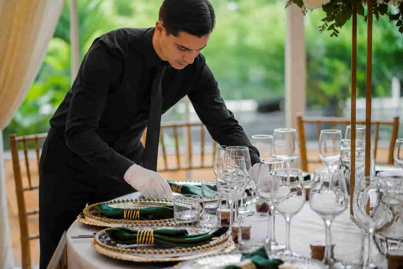 Elegant formal table setting with plates glassware and silverware arranged for a luxury event