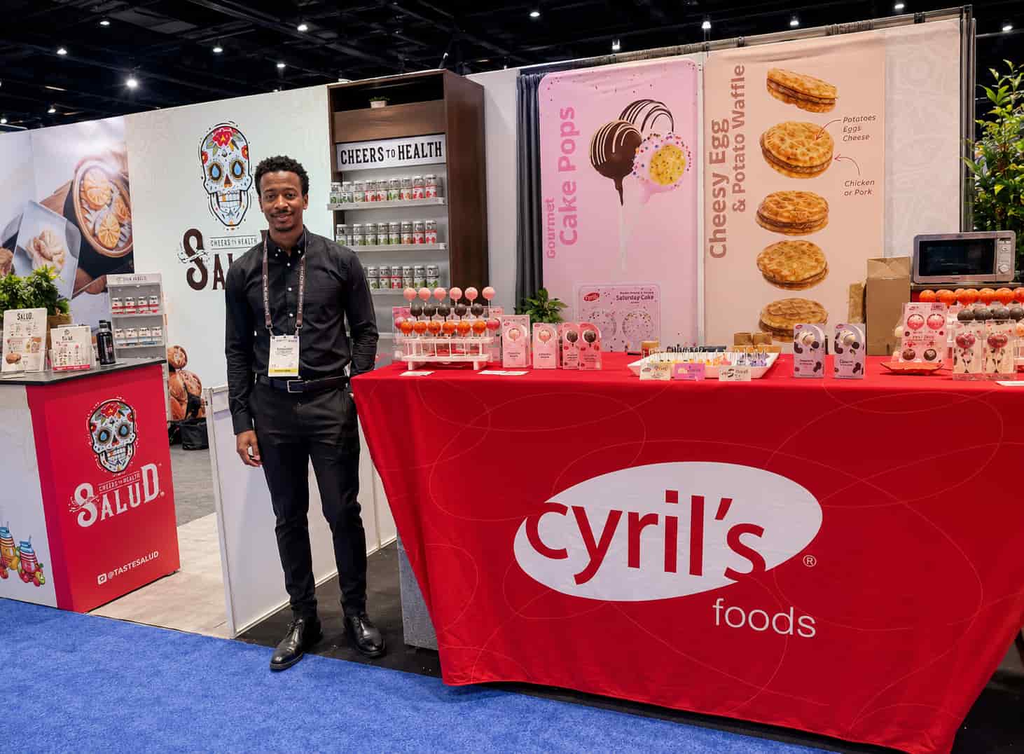 Kitchen helper preparing food samples and supporting exhibitor booth operations during the NACS Show trade show at McCormick Place in Chicago Illinois